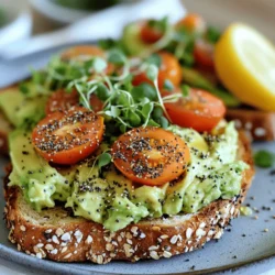 - 2 ripe avocados - 4 slices of whole grain or gluten-free bread - 2 tablespoons lemon juice - 1 teaspoon garlic powder - 2 tablespoons everything bagel seasoning - Cherry tomatoes, halved (for garnish) - Microgreens or sprouts (for garnish) - 1 teaspoon nutritional yeast - Salt and pepper to taste In this vegan avocado toast recipe, I focus on simple, fresh ingredients. The ripe avocados bring creaminess and healthy fats. Whole grain or gluten-free bread gives a hearty base, while lemon juice adds brightness. For seasonings, garlic powder adds a nice kick. Everything bagel seasoning gives a unique flavor burst. I love garnishing with halved cherry tomatoes and fresh microgreens. They add color and extra nutrients. You can elevate this dish further with nutritional yeast. It gives a cheesy flavor without dairy. Salt and pepper are also great to taste. If you want to make this dish even more special, check out the Full Recipe. You’ll find all the steps to create this delightful meal! Toasting the sliced bread Start by selecting your favorite bread. I love whole grain or gluten-free options. Place the slices in a toaster or on a baking sheet. Toast them until they are crisp and golden brown. This step adds a nice crunch to your toast. Achieving the perfect golden brown Keep an eye on the bread as it toasts. You want a nice golden color but not burnt. If using a toaster, it often takes about 3 to 5 minutes. Adjust the settings if needed to get the perfect toast. Cutting and removing the pits Grab your ripe avocados. Cut them in half and twist to open. Remove the pit carefully using a spoon or a knife. Scoop the green flesh into a bowl. Mixing in lemon juice and spices Add 2 tablespoons of lemon juice to the bowl. This brightens the flavor and keeps the avocado from browning. Next, sprinkle in the garlic powder, onion powder, and salt and pepper to taste. If you like, add nutritional yeast for a cheesy flavor. Use a fork to mash everything together. Aim for a smooth but slightly chunky mixture. Spreading the avocado mixture Once your bread is toasted, it’s time to assemble! Take a generous scoop of the avocado mix and spread it on each slice. Make sure to cover the whole slice for maximum flavor. Topping with everything bagel seasoning and garnishes Sprinkle everything bagel seasoning over the avocado. This seasoning has a great mix of flavors. For a pop of color, add halved cherry tomatoes and a handful of microgreens or sprouts on top. These garnishes make your toast not only tasty but also beautiful. For the full recipe, check out the detailed instructions above! To get perfect avocados, look for a few signs of ripeness. Ripe avocados feel slightly soft when you squeeze them gently. The skin should be dark green or almost black. Avoid avocados that feel too mushy or have dark spots. If you're not ready to use them right away, you can choose under-ripe avocados. Just let them sit on your kitchen counter for a few days. They will ripen nicely. Choosing the right bread is key for great avocado toast. Whole grain or gluten-free bread works best. These types of bread add flavor and texture. You can also try sourdough for a tangy twist. If you want to change things up, use other cooking methods. You can grill the bread for a smoky flavor or bake it in the oven. Each method gives you a different taste. Adjusting seasoning levels can make your avocado toast even better. Add more lemon juice for a zesty kick or extra garlic powder for a bold taste. Be creative with your toppings. Try adding radishes, sliced cucumbers, or even a drizzle of balsamic glaze. Each topping adds a unique flavor and makes your toast look fancy. For more ideas, check out the Full Recipe for different combinations! {{image_2}} You can use many types of bread for your avocado toast. If you need gluten-free choices, try rice bread or oat bread. These options work well and taste great. For a chewier texture, sourdough or artisan bread is perfect. The crust adds a nice crunch, and the soft inside pairs well with creamy avocado. To make your toast unique, add spices or herbs. A pinch of red pepper flakes gives it a kick. Fresh basil or cilantro can add a refreshing flavor too. You can also try spreads like hummus. This creamy base adds extra taste and nutrients to your toast. Garnishing with fresh veggies or fruits can brighten your dish. In spring, top with radishes or peas. In summer, use slices of ripe peaches or strawberries. For special events or holidays, consider festive toppings like pomegranate seeds or roasted pumpkin. These seasonal touches make your dish fun and appealing. Check out the Full Recipe for more ideas! To keep your avocado mixture fresh, follow these tips. Air causes browning, so use lemon juice to slow this down. Make sure to cover the bowl tightly with plastic wrap. Press the wrap directly onto the mixture. This keeps air out. Store the mixture in the fridge for up to two days. If you want longer storage, consider freezing. Reheating toast can be tricky. To keep it crispy, avoid the microwave. Instead, use the oven or a toaster. Heat your oven to 350°F (175°C). Place the toast on a baking sheet and warm for 5-10 minutes. If you use a toaster, toast it again lightly. This helps maintain that perfect crunch. You can freeze the avocado mixture, but it may change texture. If you want to freeze, place it in an airtight container. Leave some space at the top, as it may expand. To thaw, move it to the fridge overnight. Stir it well before serving. For the best flavor, use frozen avocado within three months. For more details, check the Full Recipe. Everything bagel seasoning is a blend of spices. It usually contains: - Sesame seeds - Poppy seeds - Dried garlic - Dried onion - Salt This mix adds a crunchy texture and bold flavor to your avocado toast. Yes, you can use frozen avocados. They are convenient and save time. However, they may lose some texture. This can make your toast less creamy. If you choose frozen, thaw them in the fridge overnight. Then, mash them like fresh avocados. To make this recipe nut-free, simply avoid any nut-based toppings. Instead, use seeds or fresh herbs. You can also add sliced radishes or cucumbers for crunch. Just ensure that your bread is also nut-free. This recipe is moderate in calories. One serving has around 250-300 calories. This depends on the bread used. The healthy fats in avocados provide great nutrition. They keep you full longer. You can prepare the avocado mixture in advance. Just store it in an airtight container. To keep it fresh, add a bit of lemon juice to slow browning. Toast the bread right before serving for the best taste. Enjoy your meal anytime! This blog post offers a simple guide to making avocado toast. You learned about key ingredients, like ripe avocados and good bread. We discussed toasting techniques and how to mash avocados for the best flavor. I shared tips for selecting avocados, along with storage methods to keep your mixture fresh. In the end, avocado toast is versatile and easy to customize. Enjoy experimenting with different flavors and toppings. You can create a delicious treat tailored just for you.