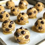 - 1 cup rolled oats - ½ cup natural almond butter (or any nut butter of choice) - ¼ cup honey or maple syrup - ½ cup vanilla protein powder - ½ cup mini chocolate chips - 1 teaspoon vanilla extract - ¼ teaspoon salt - 2 tablespoons chia seeds (optional for extra nutrients) To make No-Bake Cookie Dough Protein Bites, gather these ingredients. Rolled oats give texture. Almond butter adds creaminess. Honey or maple syrup sweetens the mix. Vanilla protein powder boosts nutrition. Mini chocolate chips add fun! Vanilla extract provides great flavor. A pinch of salt enhances everything. You can add chia seeds for extra nutrients. Each serving has about 100 calories. You get around 5 grams of protein, 10 grams of carbs, and 5 grams of fat. These bites pack a good punch of energy. They are great for a quick snack or post-workout fuel. With a balance of protein and carbs, they help keep you satisfied. 1. In a large bowl, combine the rolled oats, protein powder, and salt. Mix them well. This forms a strong base for your bites. 2. In another bowl, whisk together the almond butter, honey, and vanilla extract until it is smooth. This sweet mix adds great flavor. 3. Gradually add the wet mix to your dry mix. Stir with a spatula or wooden spoon until it is fully combined. The mixture may feel thick, but that’s okay! 1. Use your hands to shape small balls from the mixture. Aim for about 1 inch in diameter. These should be easy to pop in your mouth. 2. If the mixture is sticky, dampen your hands a bit. This helps you handle the mixture without too much mess. 1. Place the formed protein bites on a baking sheet lined with parchment paper. 2. Refrigerate for about 30 minutes. This helps them set and makes them firmer. 3. Enjoy the bites right away or store them in an airtight container in the fridge. They stay fresh for up to a week! To get the right texture for your protein bites, focus on the mixture. Use rolled oats as the base. They give a nice chew and help hold everything together. If your batter feels too dry, add a bit more nut butter or honey. If it's too wet, add more oats or protein powder. For flavor, try different nut butters. Almond butter is great, but peanut or cashew butter work too. Each nut butter gives a unique taste. If you want something fun, add a sprinkle of cinnamon or even cocoa powder. One big mistake is overmixing the ingredients. If you mix too much, the bites can turn tough. Just mix until everything is combined, and then stop. Another common mistake is not refrigerating long enough. These bites need at least 30 minutes in the fridge. This helps them set and makes them easier to eat. If you skip this step, they may fall apart when you try to grab one. {{image_2}} You can switch up the flavor with different nut butters. Try peanut butter for a classic taste. Sunflower seed butter works well for nut-free bites. Each nut butter brings its own taste and texture. Adding spices can also enhance flavor. A pinch of cinnamon can add warmth. Nutmeg offers a cozy, sweet kick. Experiment with different spices to find your favorite blend. To make these bites vegan, swap honey with maple syrup. This keeps the sweetness without animal products. You can also use agave nectar for a similar effect. For gluten-free options, choose certified gluten-free oats. This small change ensures everyone can enjoy these bites. Always check labels to avoid gluten cross-contamination. To keep your No-Bake Cookie Dough Protein Bites fresh, use an airtight container. This helps prevent them from drying out and keeps them tasty. You can store them in the fridge or the freezer. If you choose the fridge, they will be ready to eat anytime. For longer storage, freezing is best. These protein bites last about one week in the fridge. After that, they may lose their taste and texture. If you freeze them, they can last for up to three months. Just thaw them in the fridge overnight before enjoying. This way, you always have a healthy snack on hand! To make these tasty bites, follow these steps: 1. Mix dry ingredients: In a large bowl, combine 1 cup of rolled oats, ½ cup of vanilla protein powder, and ¼ teaspoon of salt. Stir well. 2. Prepare wet mix: In another bowl, whisk together ½ cup of almond butter, ¼ cup of honey (or maple syrup), and 1 teaspoon of vanilla extract. Make it smooth. 3. Combine mixtures: Gradually mix the wet ingredients into the dry mix. Stir until everything blends well. It may feel thick, but that’s fine! 4. Add chocolate chips: Fold in ½ cup of mini chocolate chips and 2 tablespoons of chia seeds (if using) until evenly mixed. 5. Shape the bites: Use your hands to form the mixture into small balls, about 1 inch wide. If it’s sticky, dampen your hands slightly. 6. Refrigerate: Place the balls on a parchment-lined baking sheet. Chill them for about 30 minutes to firm up. 7. Serve: Enjoy right away or store in an airtight container in the fridge for up to a week. Yes, you can use several types of protein powders. Here are some options: - Whey protein: A popular choice with a smooth texture. - Pea protein: Great for plant-based diets, offers a mild taste. - Soy protein: Another plant-based option with a good amino acid profile. - Hemp protein: Adds a nutty flavor and contains healthy fats. Feel free to experiment with different flavors to find your favorite! Absolutely! These protein bites are packed with nutrients. Here are some benefits: - Protein: Helps kids grow strong and stay active. - Fiber: From oats and chia seeds, it aids digestion. - Healthy fats: Found in almond butter, these fats support brain health. Serve them as an after-school snack or a fun treat. Kids love their sweet taste and chewy texture! These protein bites are simple to make and packed with nutrients. We covered the key ingredients, step-by-step instructions, and storage tips. You can easily customize flavors and adjust for dietary needs. Remember to avoid common mistakes, like overmixing and not chilling enough. With these bites, you get a nutritious snack that's great for kids and adults alike. Enjoy your healthy treat anytime!