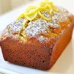 To make a perfect Lemon Poppy Seed Loaf, you need these ingredients: - 1 ½ cups all-purpose flour - 1 tablespoon poppy seeds - 1 teaspoon baking powder - ½ teaspoon baking soda - ¼ teaspoon salt - ½ cup unsalted butter, softened - 1 cup granulated sugar - 2 large eggs - Zest of 1 large lemon - ¼ cup fresh lemon juice - ½ cup plain yogurt - 1 teaspoon vanilla extract - Powdered sugar for dusting (optional) You can make this loaf suit your needs. Here are some options: - For gluten-free, use a gluten-free flour blend. - Swap yogurt with applesauce for a lighter loaf. - Use coconut oil instead of butter for a dairy-free version. - If you want to cut sugar, try using a sugar substitute. This loaf serves about 8 to 10 people. Each slice has: - Calories: 200 - Fat: 8g - Carbohydrates: 30g - Protein: 3g - Fiber: 1g This recipe gives you a treat that is tasty and satisfying! To make this lemon poppy seed loaf, gather your ingredients first. You need flour, poppy seeds, baking powder, baking soda, salt, butter, sugar, eggs, lemon zest, lemon juice, yogurt, and vanilla. Preheat your oven to 350°F (175°C). Grease or line a 9x5 inch loaf pan. This will help your loaf come out easily. 1. In a medium bowl, whisk together the flour, poppy seeds, baking powder, baking soda, and salt. Set this bowl aside. 2. In a large bowl, beat the softened butter and sugar together. Use an electric mixer on medium speed for about 3 minutes. The mixture should be light and fluffy. 3. Add the eggs one at a time. Mix well after each egg. Then, add the lemon zest, lemon juice, yogurt, and vanilla extract. Mix until all is combined. 4. Gradually add the dry mix to the wet mix. Use low speed to combine. Do not overmix; a few lumps are fine. 5. Pour the batter into your prepared loaf pan. Smooth the top with a spatula. 6. Place the loaf pan in the oven. Bake for 50-60 minutes. To check if your loaf is done, insert a toothpick into the center. If it comes out clean, your loaf is ready. If it has batter on it, bake a little longer. Once baked, remove the loaf from the oven. Let it cool in the pan for about 10 minutes. Then, transfer it to a wire rack to cool completely. If you like, dust the top with powdered sugar before slicing. Enjoy your moist, fresh lemon poppy seed loaf! To make a great lemon poppy seed loaf, watch out for a few common mistakes. - Overmixing the batter: This can lead to a tough loaf. Mix until just combined. - Skipping the lemon zest: Zest adds a bright flavor. Don’t leave it out! - Not measuring ingredients: Use measuring cups for accuracy. This helps the loaf rise well. - Ignoring oven temp: Always preheat your oven. A cold oven can ruin your bake. Keeping your loaf moist is key for a tasty treat. Here are some tips: - Use yogurt: The yogurt in the recipe adds moisture and richness. - Check doneness early: Start checking at 50 minutes. Overbaking dries it out. - Cool properly: Let it cool in the pan for a bit. This helps keep moisture in. - Wrap well: If you have leftovers, wrap them in plastic wrap. This keeps the loaf moist. Serving your lemon poppy seed loaf can be fun and creative. Here are some ideas: - With tea or coffee: It pairs well with a warm drink. - Top with glaze: Mix lemon juice and powdered sugar for a sweet glaze. - Add fruit: Serve with fresh berries for a colorful plate. - Dust with powdered sugar: A light dusting adds a nice touch. {{image_2}} To make a gluten-free version, swap regular flour for gluten-free all-purpose flour. Ensure the blend has xanthan gum, as it helps bind the loaf. This change keeps the texture light and moist. Follow the same instructions as listed in the original recipe. You won’t miss the gluten! For a vegan option, replace eggs with flax eggs. Mix one tablespoon of ground flaxseed with three tablespoons of water. Let it sit for a few minutes until it thickens. Use plant-based butter and dairy-free yogurt. These swaps keep the loaf moist and delicious without any animal products. You can add unique flavors to your loaf. Consider mixing in blueberries or raspberries for a fruity twist. A teaspoon of almond extract adds a nice touch. You can also fold in chopped nuts, like walnuts or pecans, for crunch. If you love a sweeter loaf, add a bit more sugar or a glaze made of lemon juice and powdered sugar. Each variation offers a new experience! To keep your lemon poppy seed loaf fresh, wrap it tightly in plastic wrap. This keeps air out and moisture in. You can also place it in an airtight container. Store it at room temperature for up to three days. If you want it to last longer, the fridge is a good option. Just note that refrigeration may slightly dry it out. You can freeze your lemon poppy seed loaf for up to three months. First, let the loaf cool completely. Then, wrap it in plastic wrap and aluminum foil. This will prevent freezer burn. When you are ready to enjoy it again, thaw it overnight in the fridge. You can also leave it at room temperature for a few hours. To reheat your loaf, slice it first. This helps heat it evenly. Preheat your oven to 350°F (175°C). Place the slices on a baking sheet. Heat for about 10 to 15 minutes. Alternatively, use a microwave. Heat each slice for about 15 to 20 seconds. Just be careful not to overheat it, as it can become dry. Enjoy your moist and tasty loaf! Yes, you can! Orange and lime work well. They add a fresh twist. Just use the same amount of zest and juice. Adjust the sugar if needed. This change gives new flavor notes. You can even mix citrus for fun. If you don't have yogurt, use sour cream. It gives a similar tang. Buttermilk is another option. You can also try unsweetened applesauce. Each will keep your loaf moist. Just use the same amount as the yogurt in the recipe. Check the loaf after 50 minutes. Insert a toothpick into the center. If it comes out clean, the loaf is ready. If there’s wet batter, bake a bit longer. The top should be golden brown too. Let it cool for 10 minutes before removing. This blog post explored how to make a delicious Lemon Poppy Seed Loaf. We covered ingredients, substitutions, and nutrition details. You now have step-by-step instructions to bake it perfectly. I also shared tips to avoid common mistakes and keep your loaf moist. You learned about gluten-free and vegan options, plus smart storage methods. Finally, the FAQs answered your key questions. Use this guide to bake and enjoy your loaf with confidence. Happy baking!