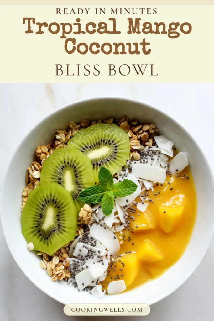Discover the deliciousness of a Mango Coconut Smoothie Bowl! This Healthy Mango Smoothie Recipe is a perfect tropical treat that's quick to make, taking just 10 minutes. With coconut yogurt for creaminess and topped with kiwi, granola, and more, it's a feast for the eyes and taste buds. Perfect for breakfast or a snack! Try this Tropical Smoothie Bowl today and elevate your smoothie bowl game. Don't forget to save for later! #MangoCoconutSmoothieBowl #HealthySmoothie #TropicalSmoothie #SmoothieBowlToppings